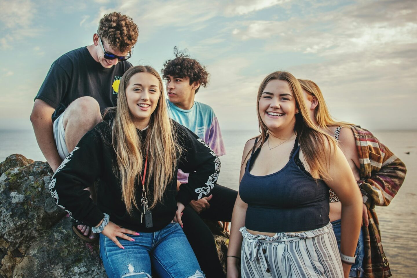 Group of teen friends relaxing by the water, teen therapy Anchorage Alaska